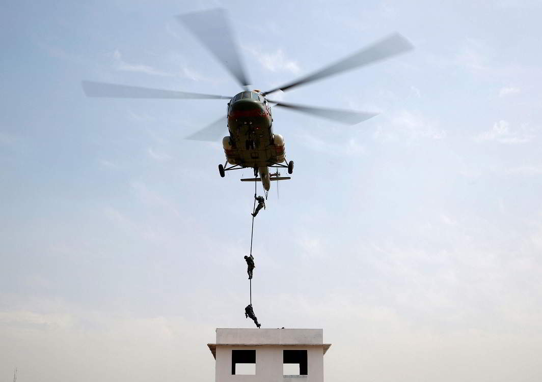 SAFETY MANOEUVRES: Members of Nepalese army demonstrate their rescue skills during rehearsal for the upcoming Army Day celebration at Tundhikhel in Kathmandu, Nepal, Reuters/UNI