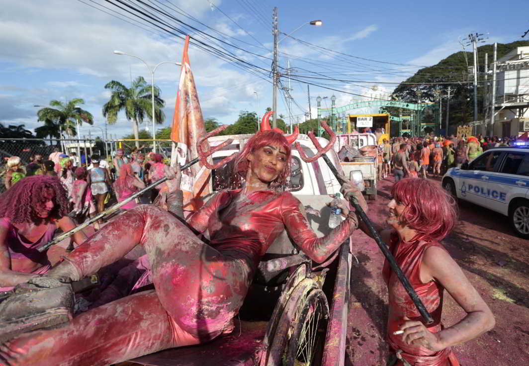 COLOUR AND MADNESS: Revellers participate in a carnival in Port-of-Spain, Trinidad and Tobago, Reuters/UNI