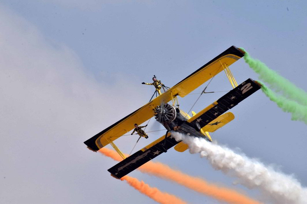 DAREDEVILS: The Yakolevs Aerobatic Display Team catwalks over an aircraft during Aero India-2017 at Yelahanka airbase in Bengaluru, UNI