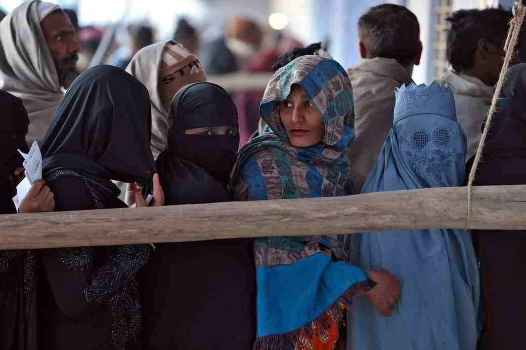 WHICH WAY DID THEY VOTE? People queue up to cast their vote during the state assembly election in the village of Kairana, in UP on feb 11, UNI