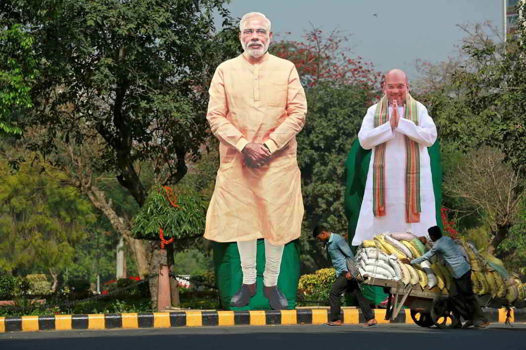 MAN OF THE MOMENT: Giant cardboard cutouts of Indian Prime Minister Narendra Modi (centre) and Bharatiya Janata Party president Amit Shah displayed in the capital, Reuters/UNI