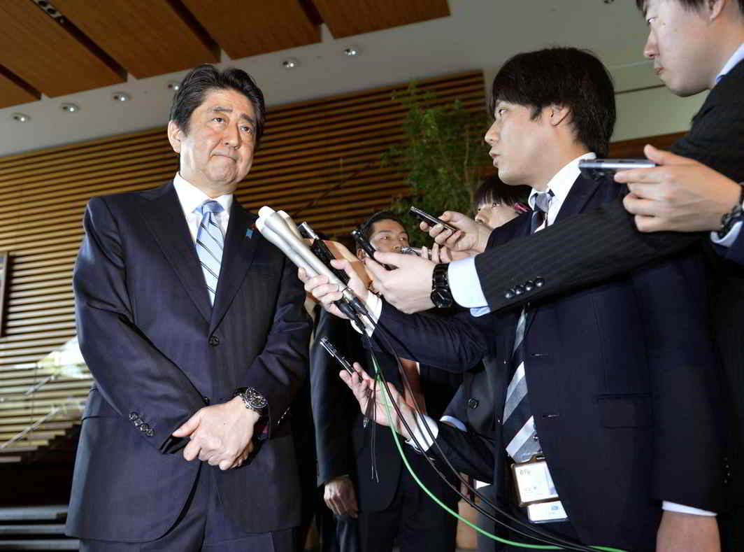 NEIGHBOURHOOD MATTERS: Japanese Prime Minister Shinzo Abe speaks to reporters at his office in Tokyo following North Korea's latest ballistic missile launch, Kyodo/Reuters/UNI