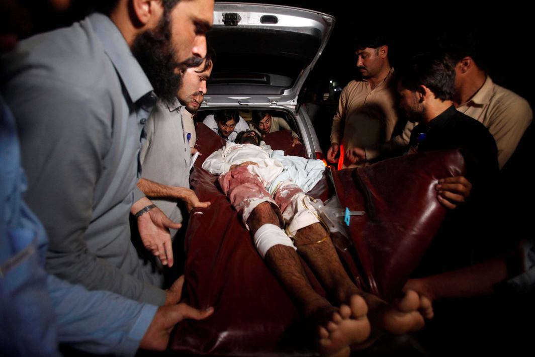 A man injured in the blasts is carried to a hospital in JaiPur