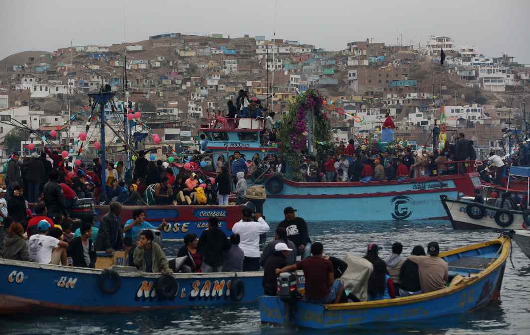 SAINTS GO SAILING: People take the religious icon of Saint Peter out on a boat along the coast during the Feast of Saint Peter and Saint Paul in Pucusana port in Lima, Peru, Reuters/UNI