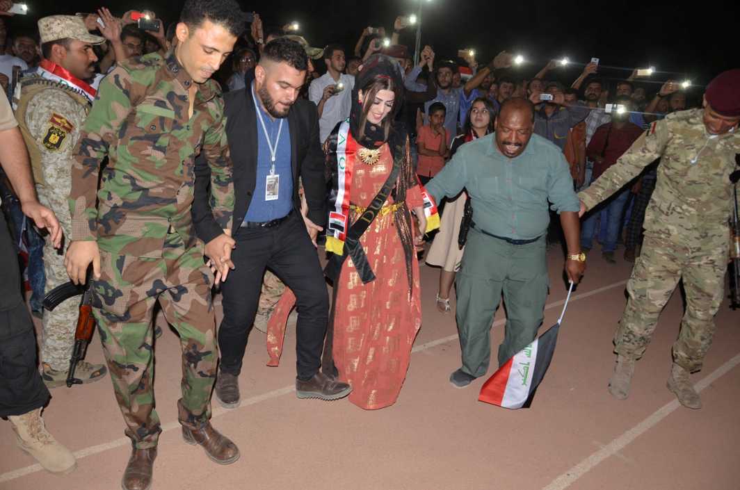 FREEDOM: People celebrate after Prime Minister Haider al-Abadi declares victory over militants in the de facto Iraqi capital of their self-declared caliphate in Mosul, Iraq, Reuters/UNI