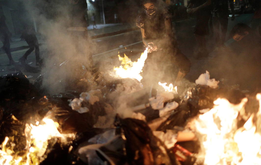 BURN BABY BURN: A demonstrator burns a barricade during a protest against President Michel Temer's proposal reform of Brazil's social security system in a general strike in Rio de Janeiro, Reuters/UNI