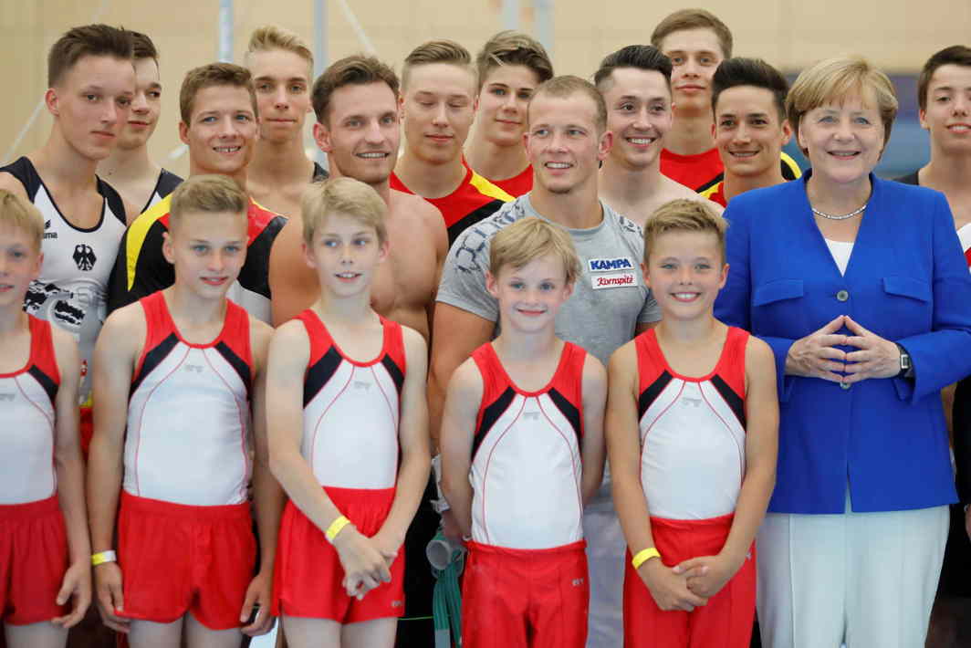 DEUSTCHLAND DUTIES: German Chancellor Angela Merkel visits a German Olympics training ground where she observes gymnasts in Kienbaum, Germany, Reuters/UNI