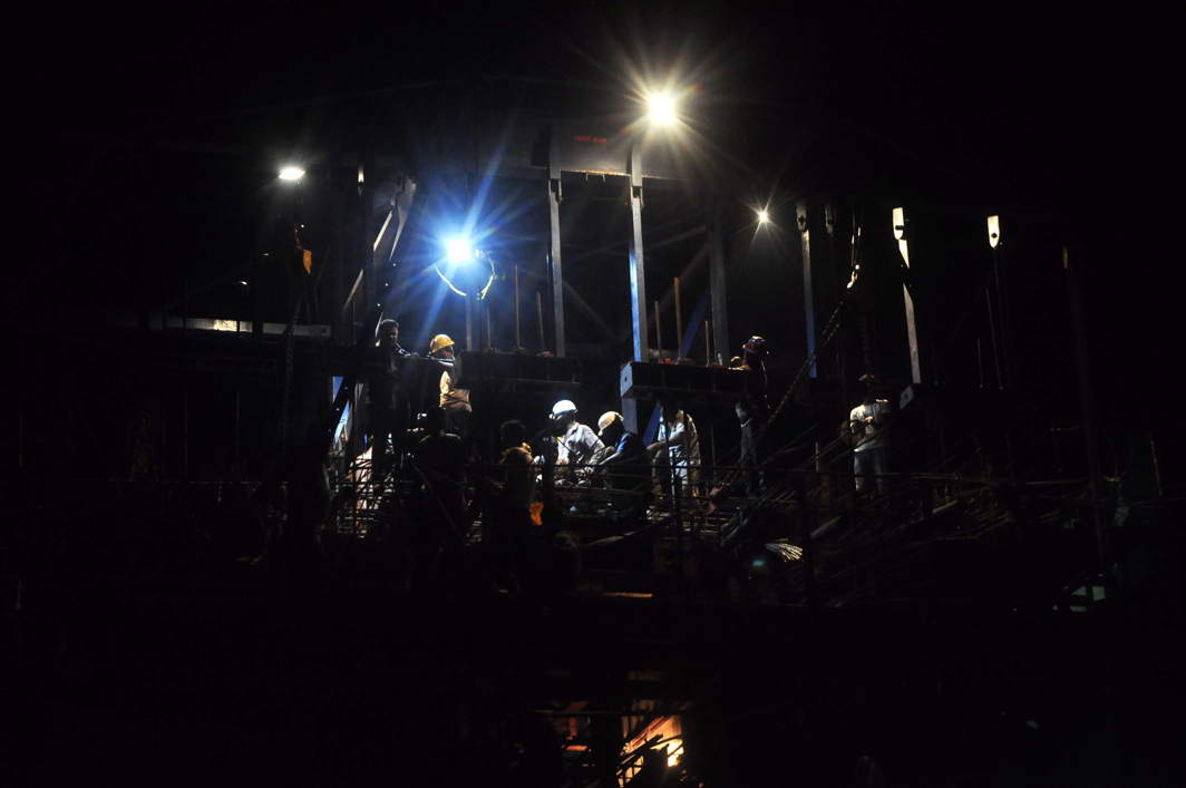 ALL NIGHT LONG: Men at work during the construction of the first flyover in Agartala, UNI