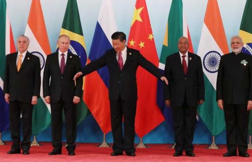 (From left to right:) Brazil’s President Michel Temer, Russian President Vladimir Putin, Chinese President Xi Jinping, South African President Jacob Zuma and Indian Prime Minister Narendra Modi prepare to pose for a group photo during the BRICS Summit at Xiamen