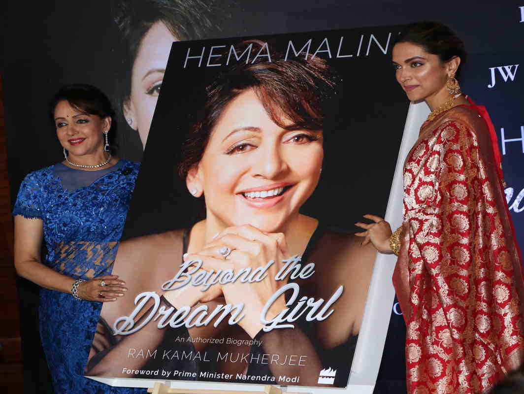 AN ENIGMA: Bollywood actress Deepika Padukone, with Hema Malini, launches the official biography of the legendary actress Hema Malini "Beyond the Dream Girl" in Mumbai, UNI