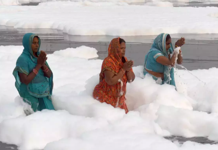 devotees take a dip in river Yamuna