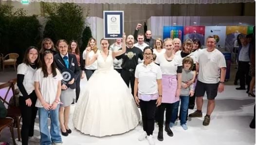 Switzerland Woman wearing largest wearable cake dress