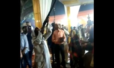 man flaunting weapon during marriage ceremony