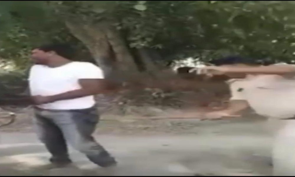 Police officer thrashes man