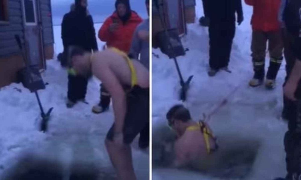 Watch: Man jumps into a frozen lake to retrieve friend’s lost phone