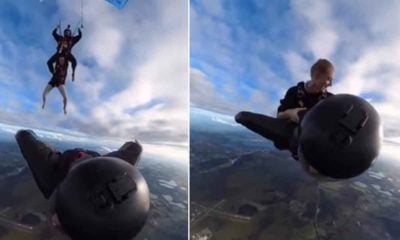 Watch: Woman does a hair raising stunt as she jumps off one sky diver onto another one