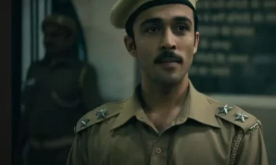 A scene from Black Warrant showing a young jailer walking through Tihar Jail’s corridors, surrounded by inmates.