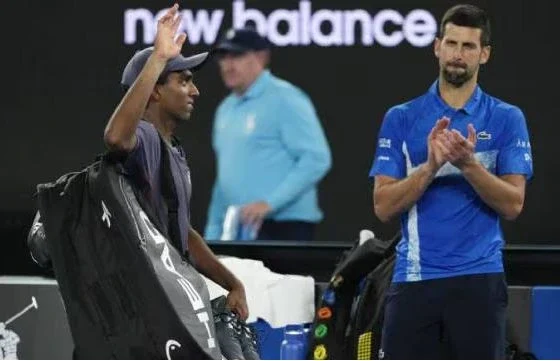 Nishesh Basavareddy playing a backhand shot against Novak Djokovic at the Australian Open 2025