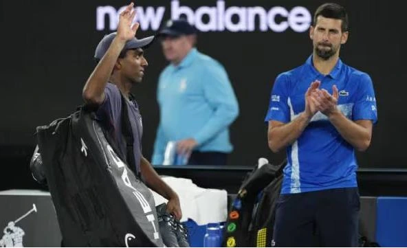 Nishesh Basavareddy playing a backhand shot against Novak Djokovic at the Australian Open 2025