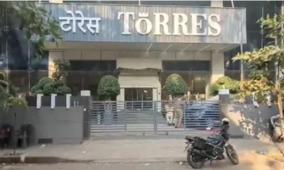 Investors gather outside Torres Jewellery store in Mumbai demanding their money back after being scammed in a Ponzi scheme.