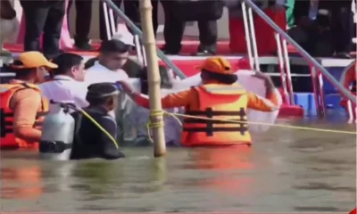 President Droupadi Murmu taking a holy dip at the Triveni Sangam during Maha Kumbh in Prayagraj.