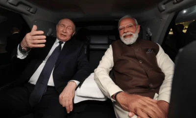 Vladimir Putin rides in Indian PM Narendra Modi's car on India visit