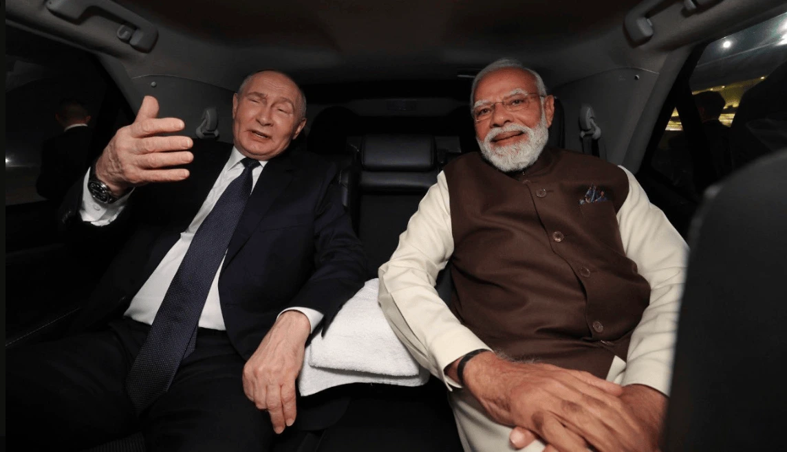 Vladimir Putin rides in Indian PM Narendra Modi's car on India visit